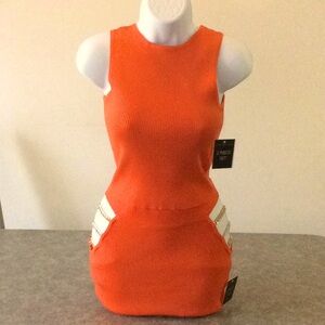 a ribbed knit crop top and chain detail skirt set